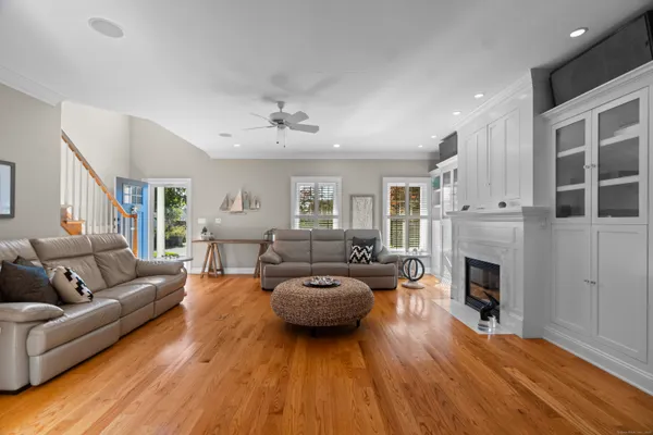 a living room with furniture and a fireplace