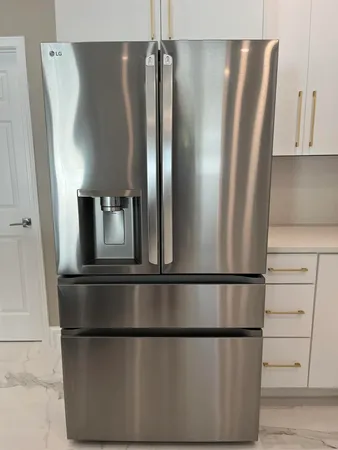 a stove top oven sitting inside of a kitchen