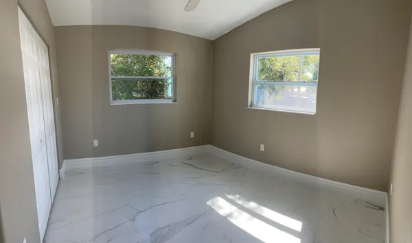 an empty room with windows