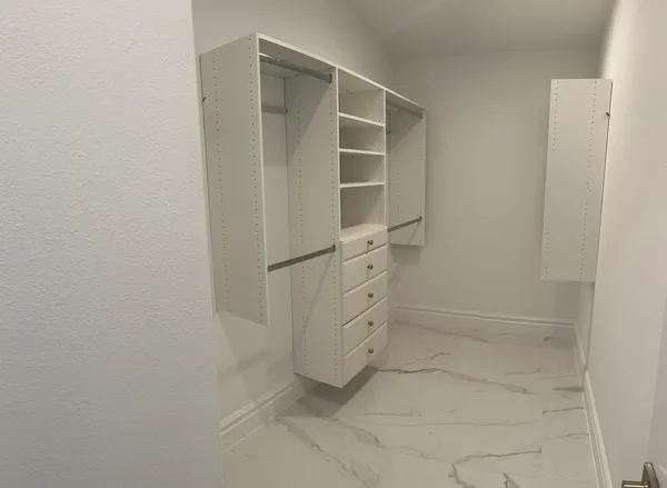 a bathroom with a double vanity sink and mirror