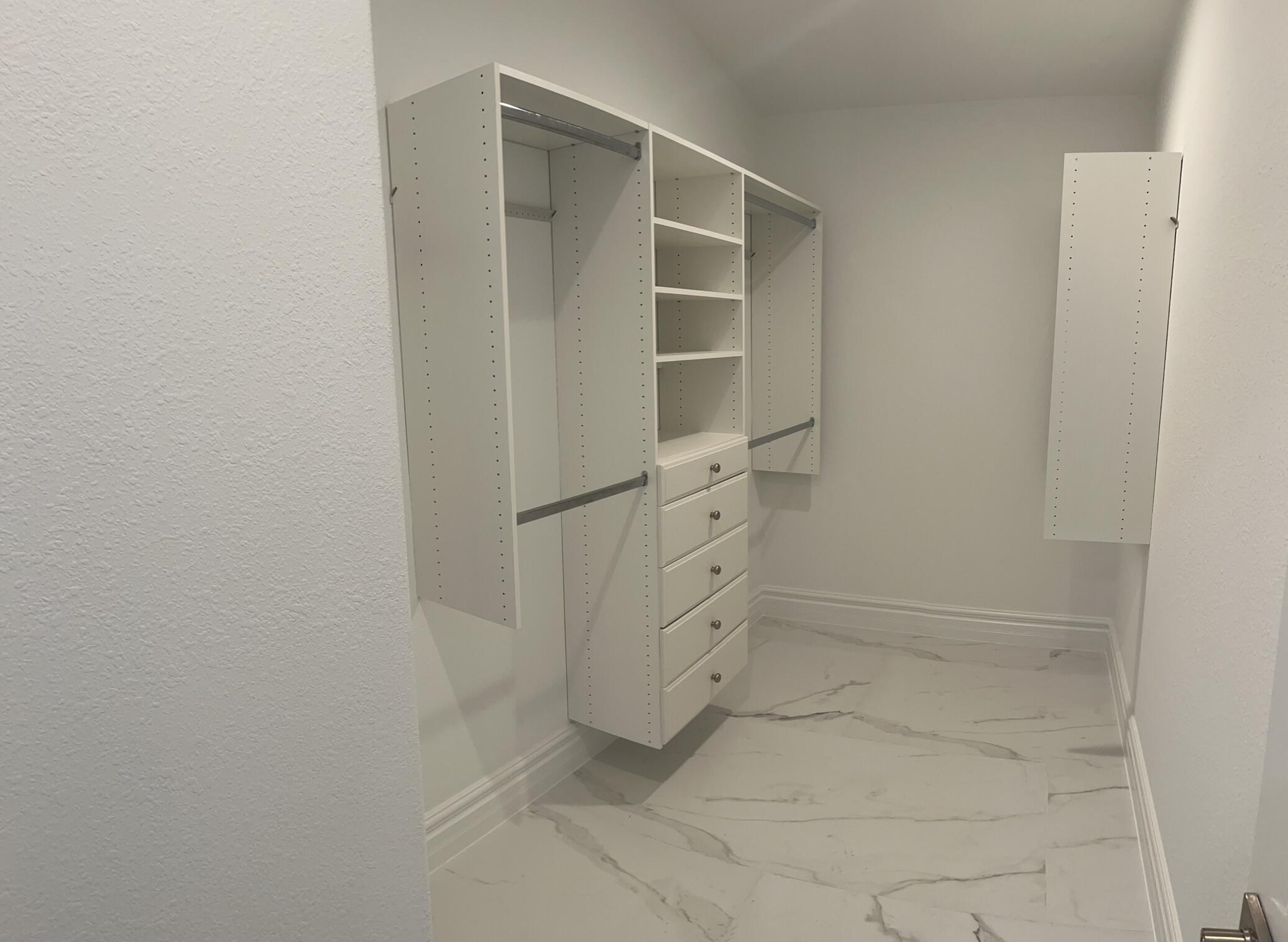 32 Bonefish Avenue Key Largo, FL 33037 - Photo 27 of 34 a view of walk in closet with empty racks