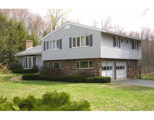 91 Three Rivers Road Wilbraham, MA 01095 - Photo 1 of 1 a front view of a house with a yard