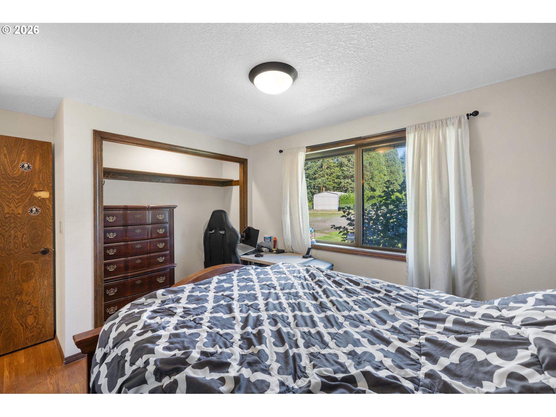 18489 South Ferguson Road Oregon City, OR 97045 - Photo 14 of 39 a bedroom with a bed and a television