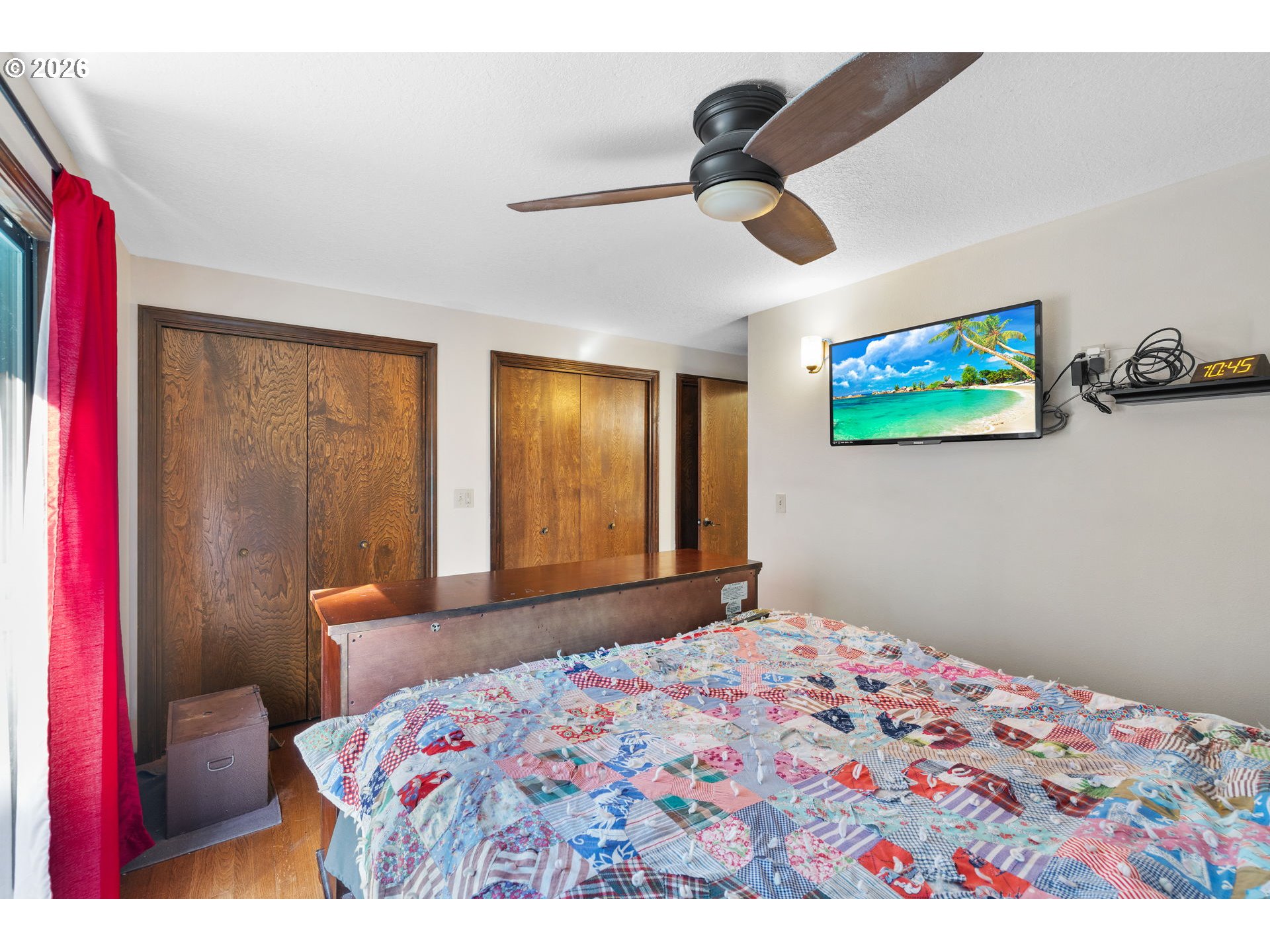18489 South Ferguson Road Oregon City, OR 97045 - Photo 15 of 39 a bedroom with a bed and a painting on the wall