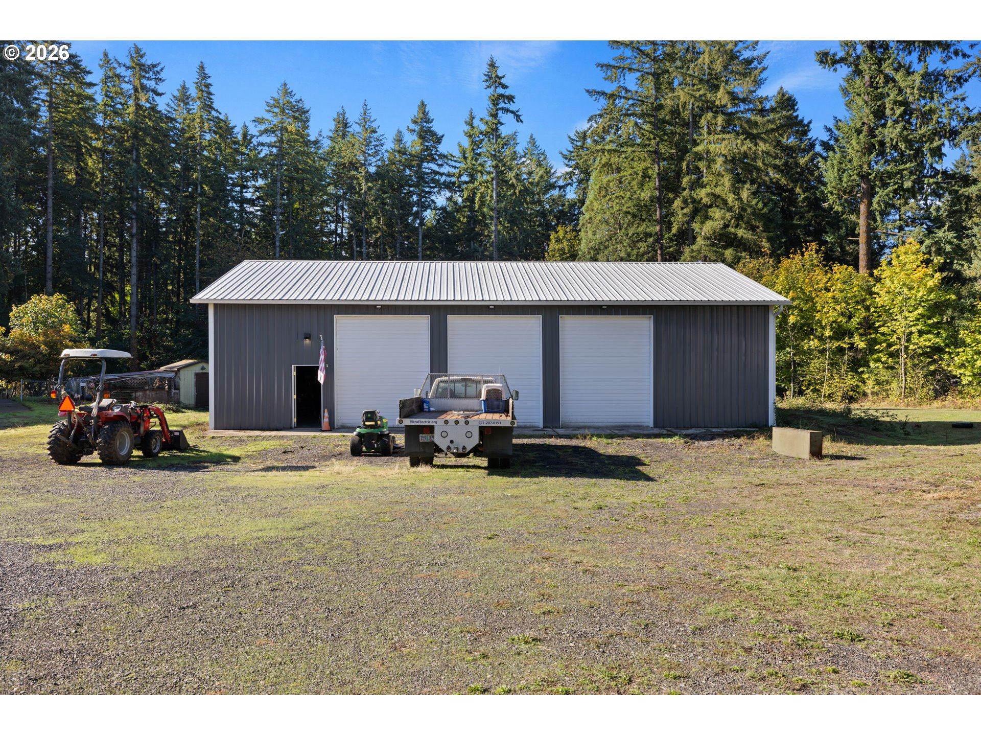 18489 South Ferguson Road Oregon City, OR 97045 - Photo 29 of 39 a view of a house with large space and a car parked in front of it