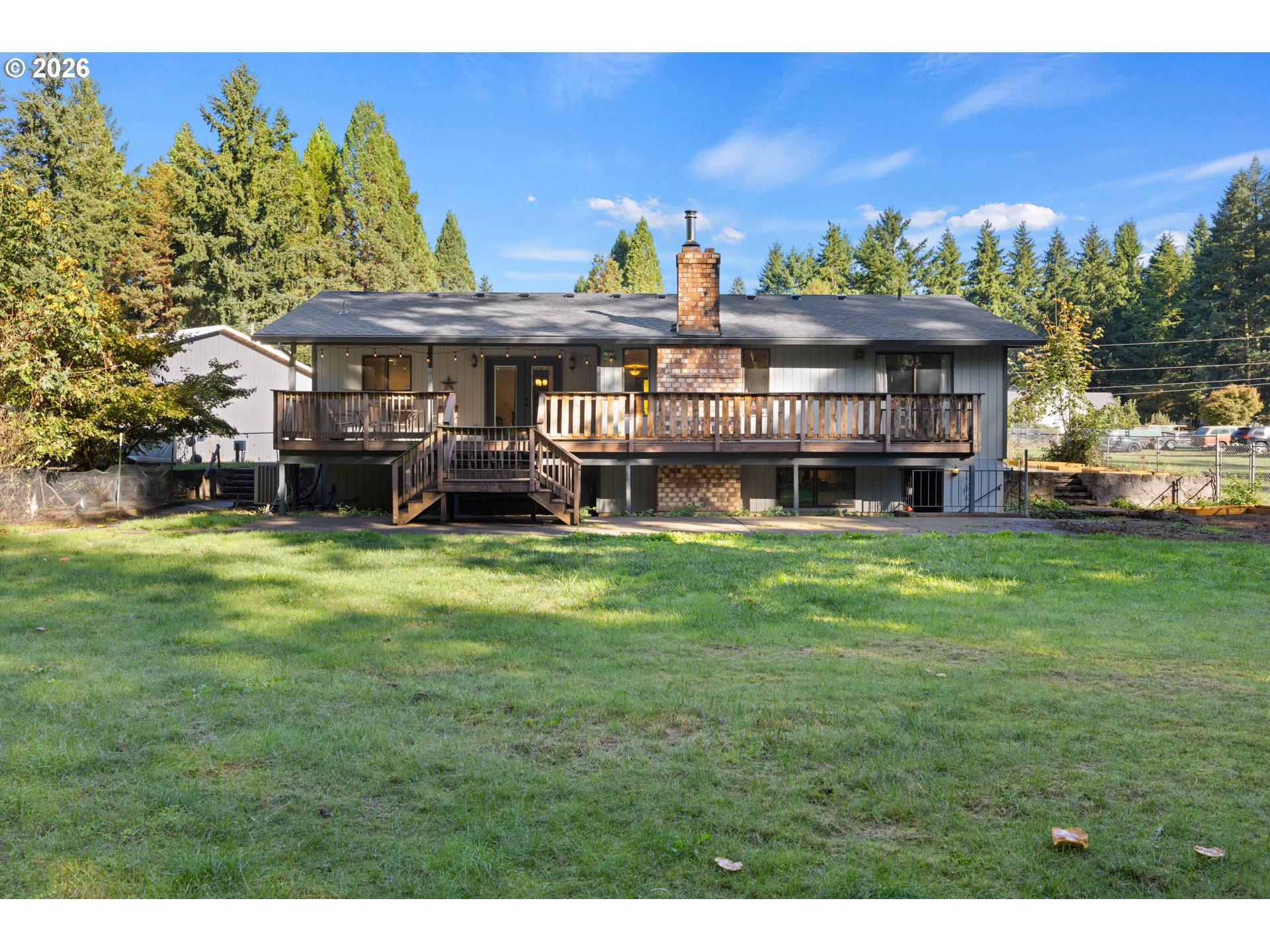 18489 South Ferguson Road Oregon City, OR 97045 - Photo 33 of 39 a view of a big house with a big yard and large trees