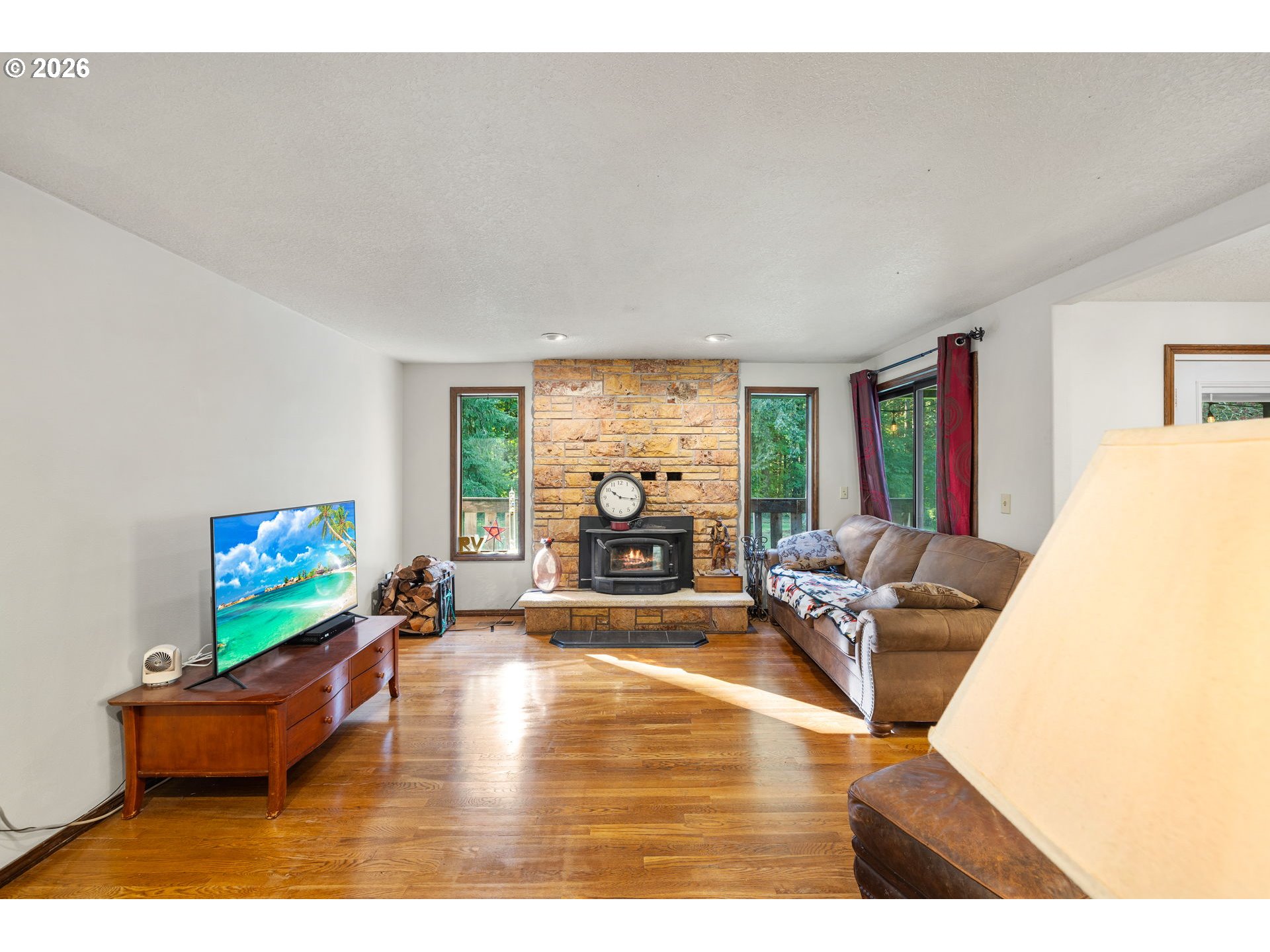 18489 South Ferguson Road Oregon City, OR 97045 - Photo 8 of 39 a living room with furniture and a flat screen tv