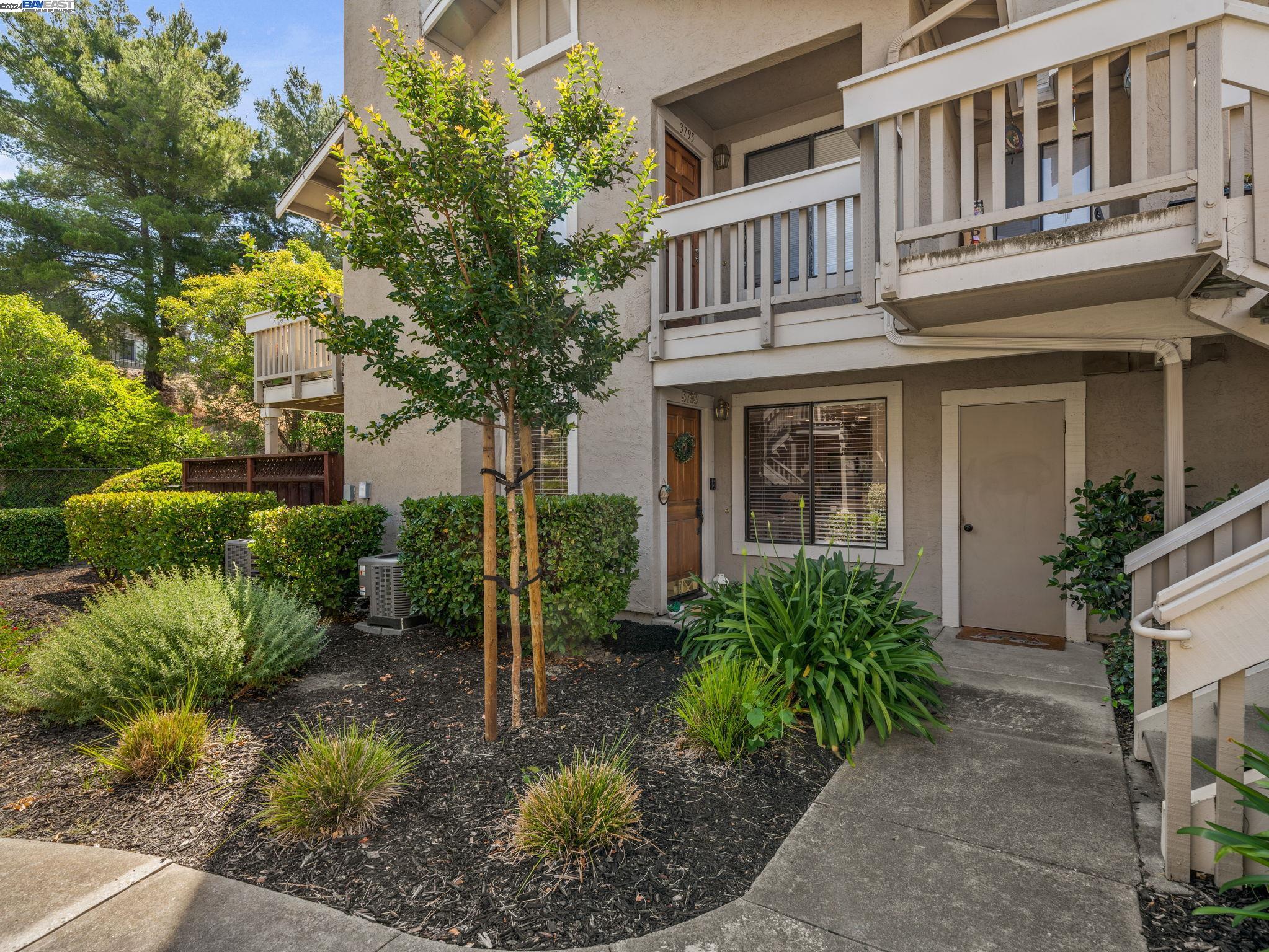 3793 Crow Canyon Road San Ramon, CA 94582 - Photo 1 of 1 a view of a house with brick walls plants and large tree