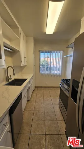 a view of kitchen with stainless steel appliances