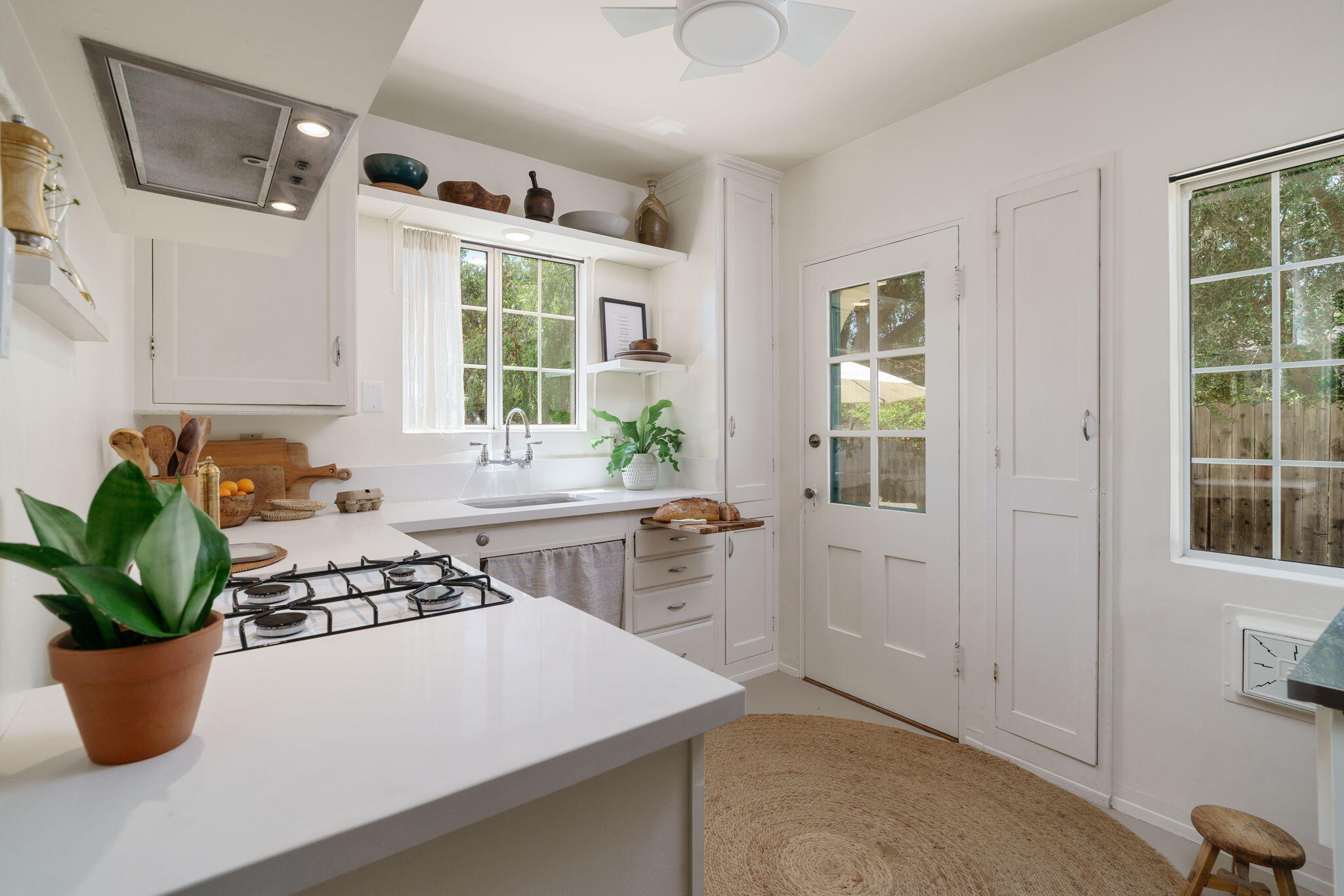 314 West Aliso Street, Unit A Ojai, CA 93023 - Photo 12 of 29 a kitchen with a white stove top oven and potted plant