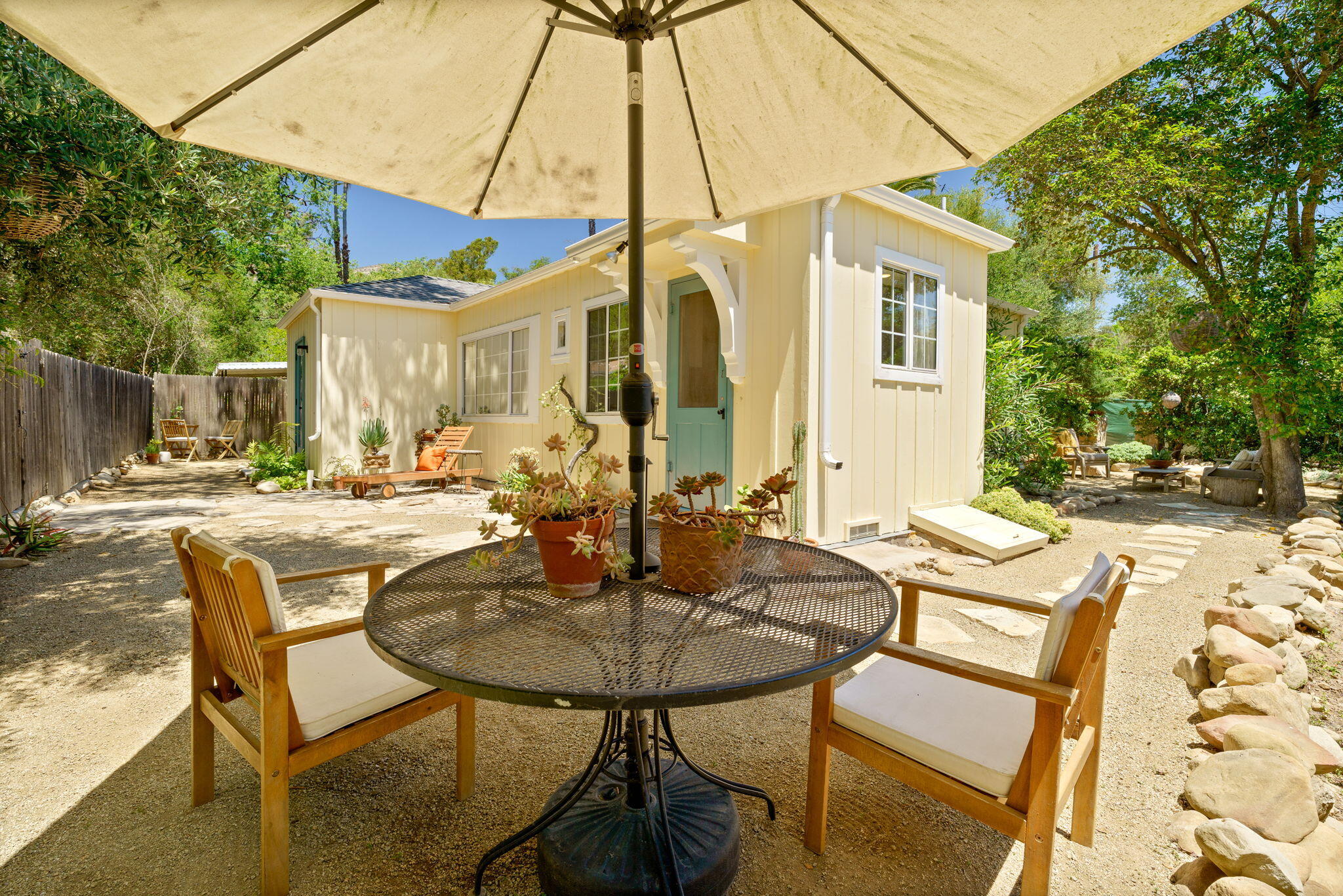 314 West Aliso Street, Unit A Ojai, CA 93023 - Photo 25 of 29 a view of a patio with table and chairs and potted plants