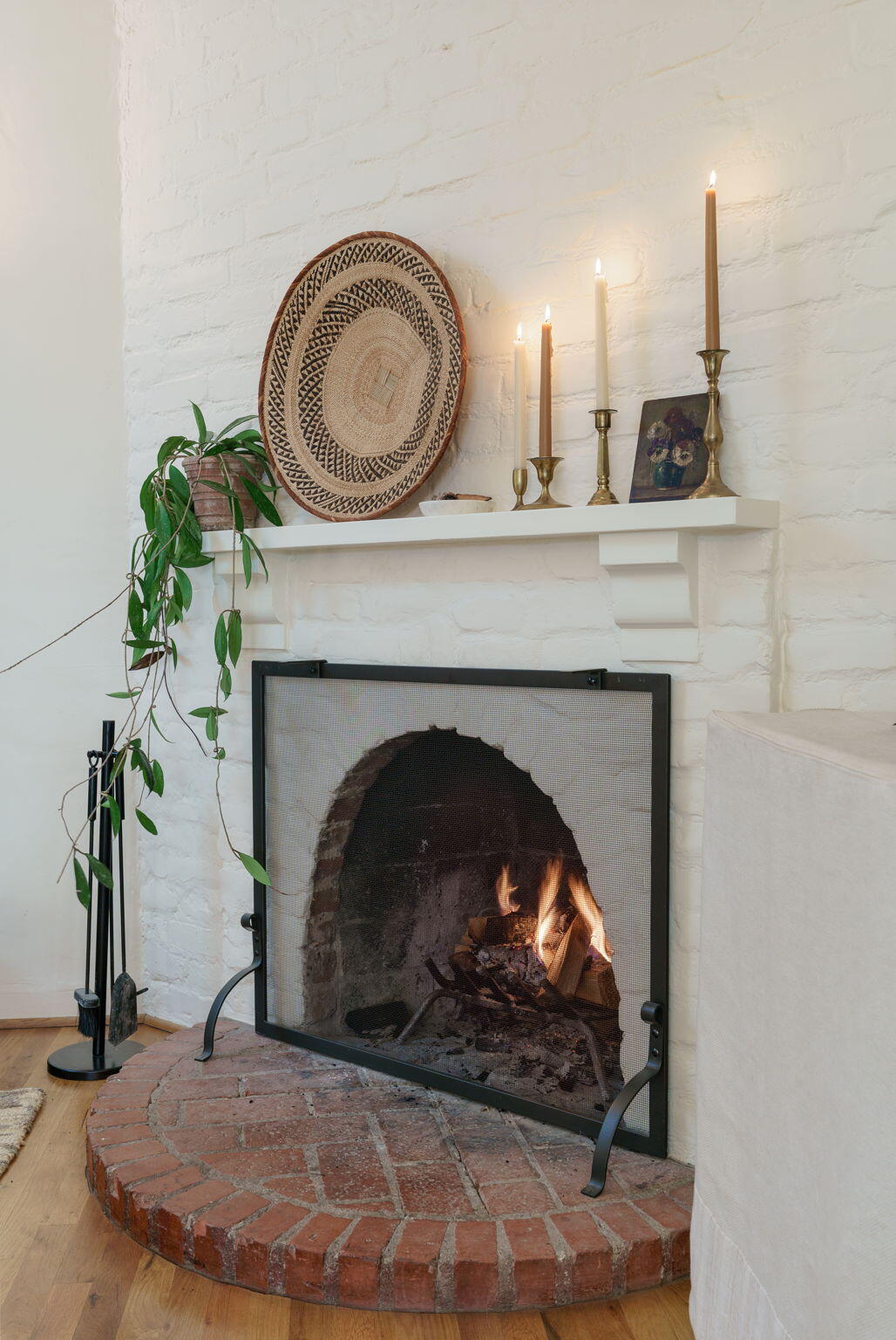 314 West Aliso Street, Unit A Ojai, CA 93023 - Photo 9 of 29 a living room with a fireplace and a clock on the wall