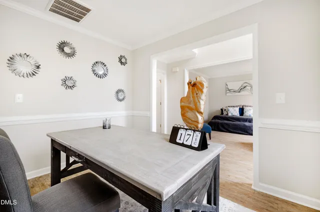 a view of kitchen with a table and chairs