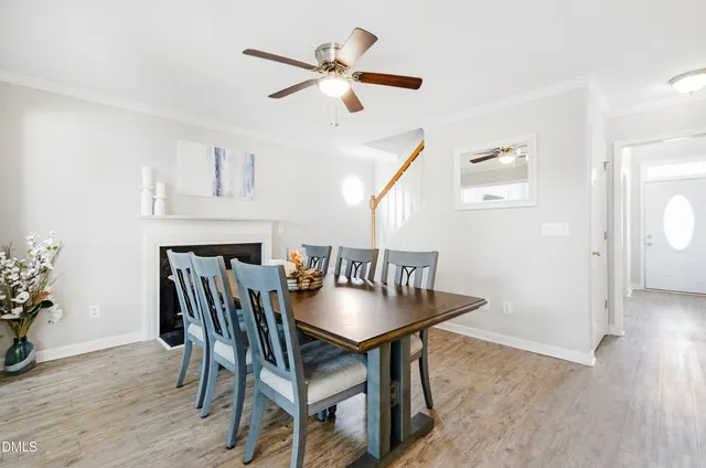 a dining room with furniture and window