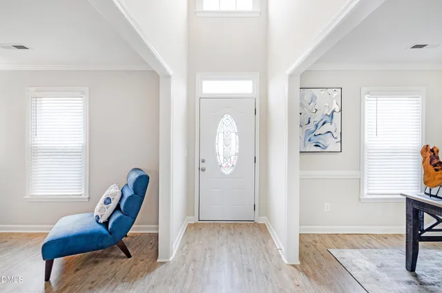 a view of a livingroom with furniture and wooden floor