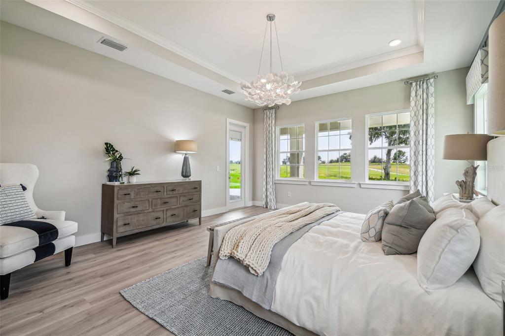 6406 Summit View Drive Brooksville, FL 34601 - Photo 41 of 59 a bedroom with a bed and ceiling fan