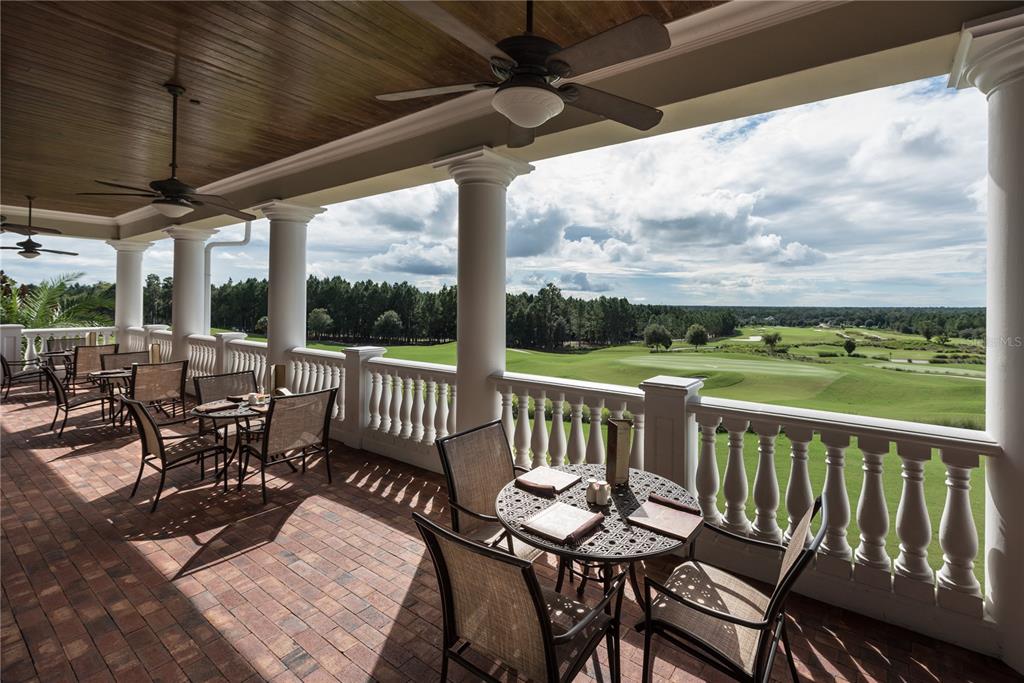 6406 Summit View Drive Brooksville, FL 34601 - Photo 52 of 59 a view of a patio with a table chairs and a glass top table