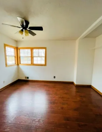 a view of a kitchen with a sink and cabinets