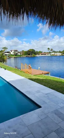a view of swimming pool and lake