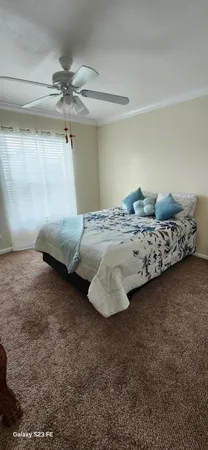 a bedroom with a bed and lamp