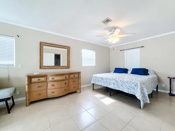 a bedroom with a bed and a dresser