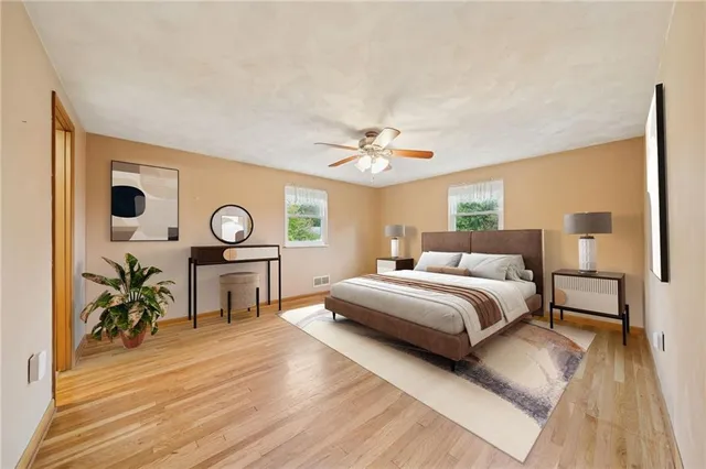 a spacious bedroom with a bed and a table