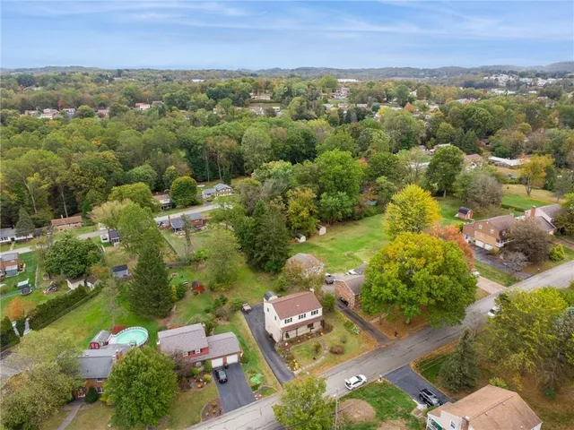 an aerial view of a city with lots of residential buildings