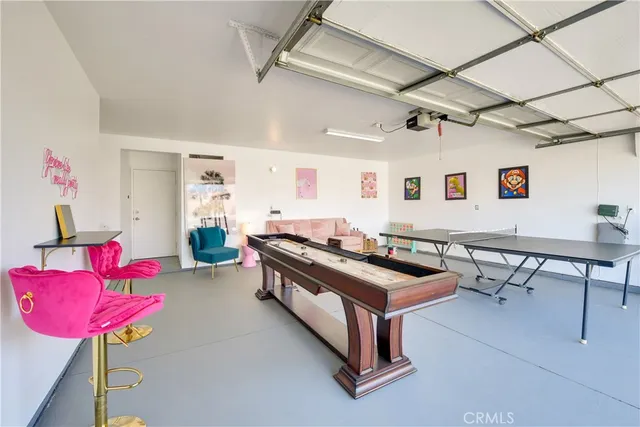 a bedroom with furniture and a chair