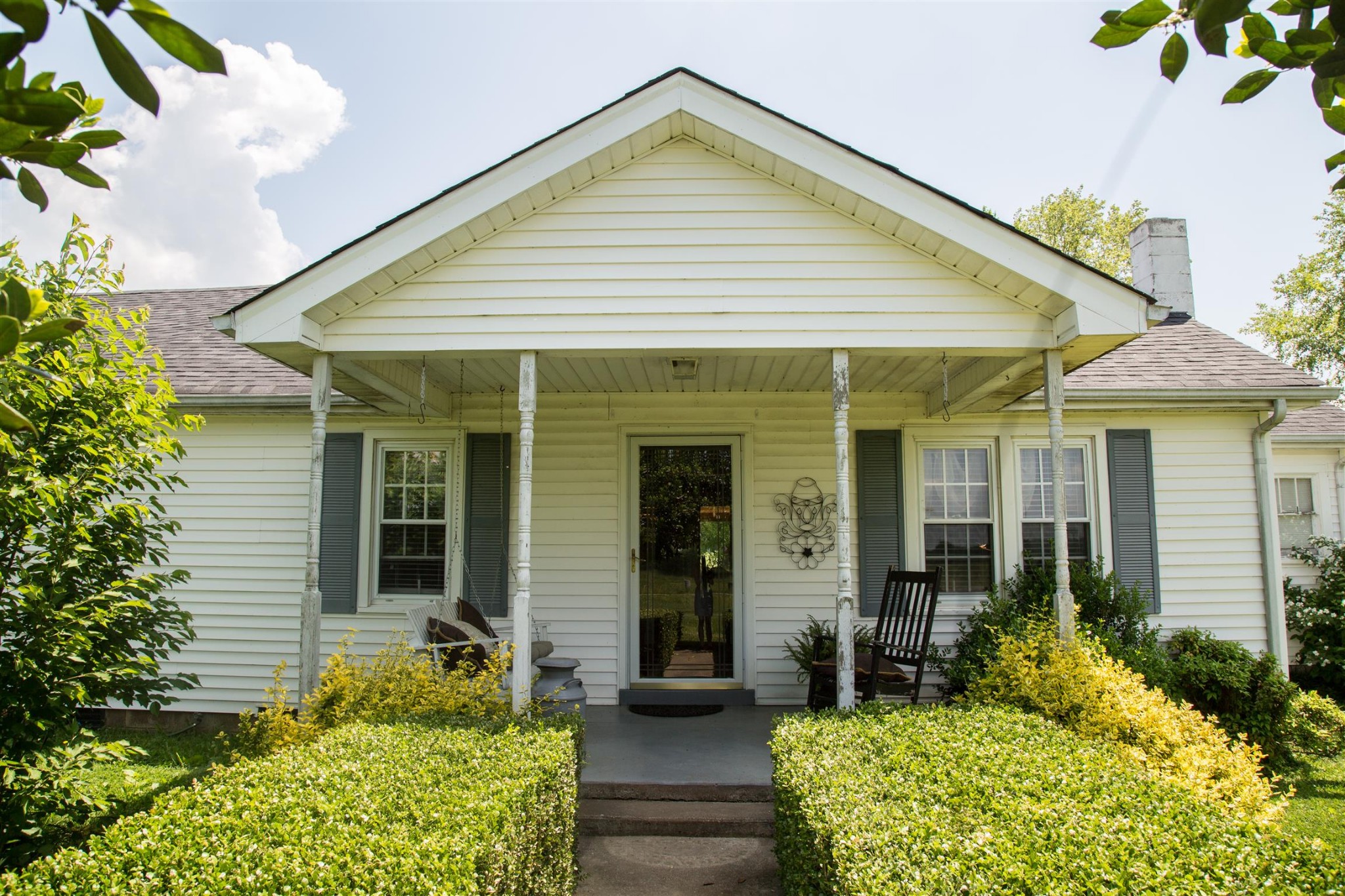 699 Mcelhiney Road Dickson, TN 37055 - Photo 2 of 25 a view of a house with potted plants and a table and chairs