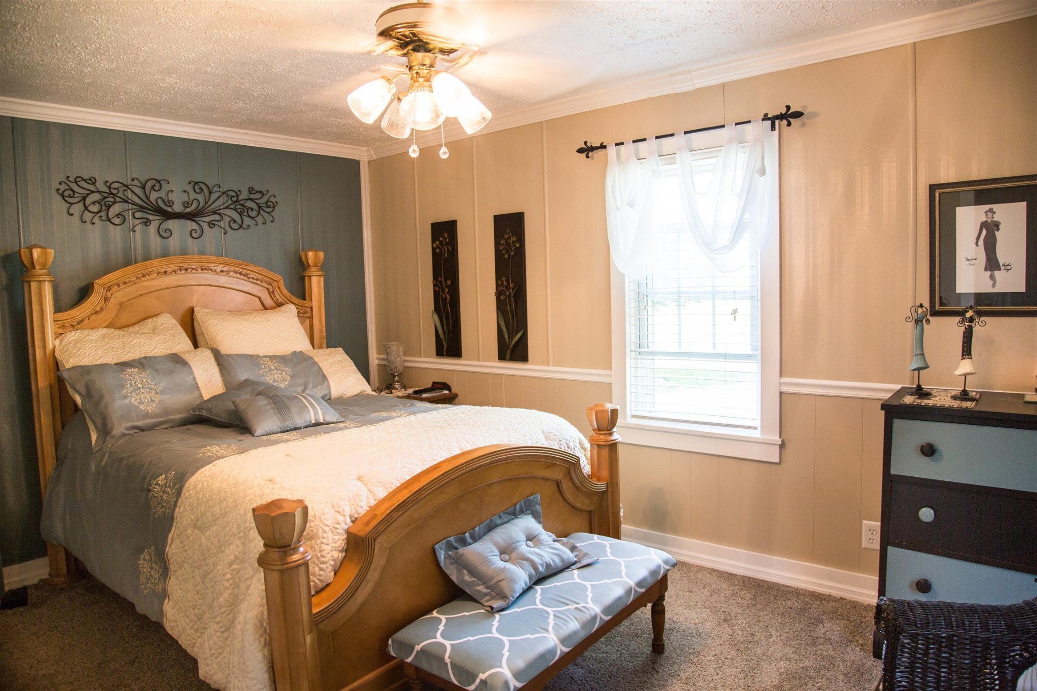 699 Mcelhiney Road Dickson, TN 37055 - Photo 16 of 25 a bedroom with a bed and a chandelier