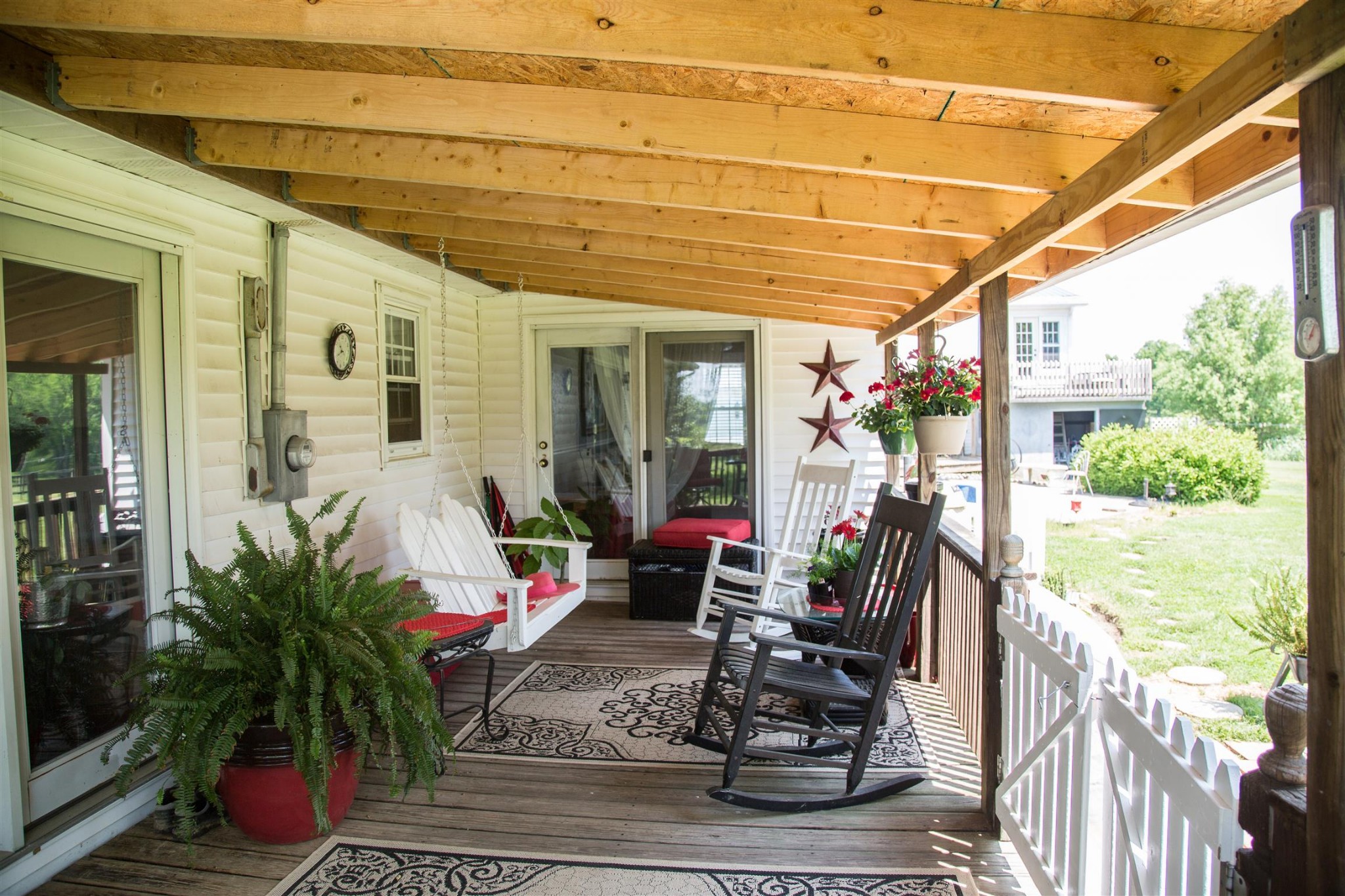 699 Mcelhiney Road Dickson, TN 37055 - Photo 20 of 25 a view of a patio with table and chairs potted plants