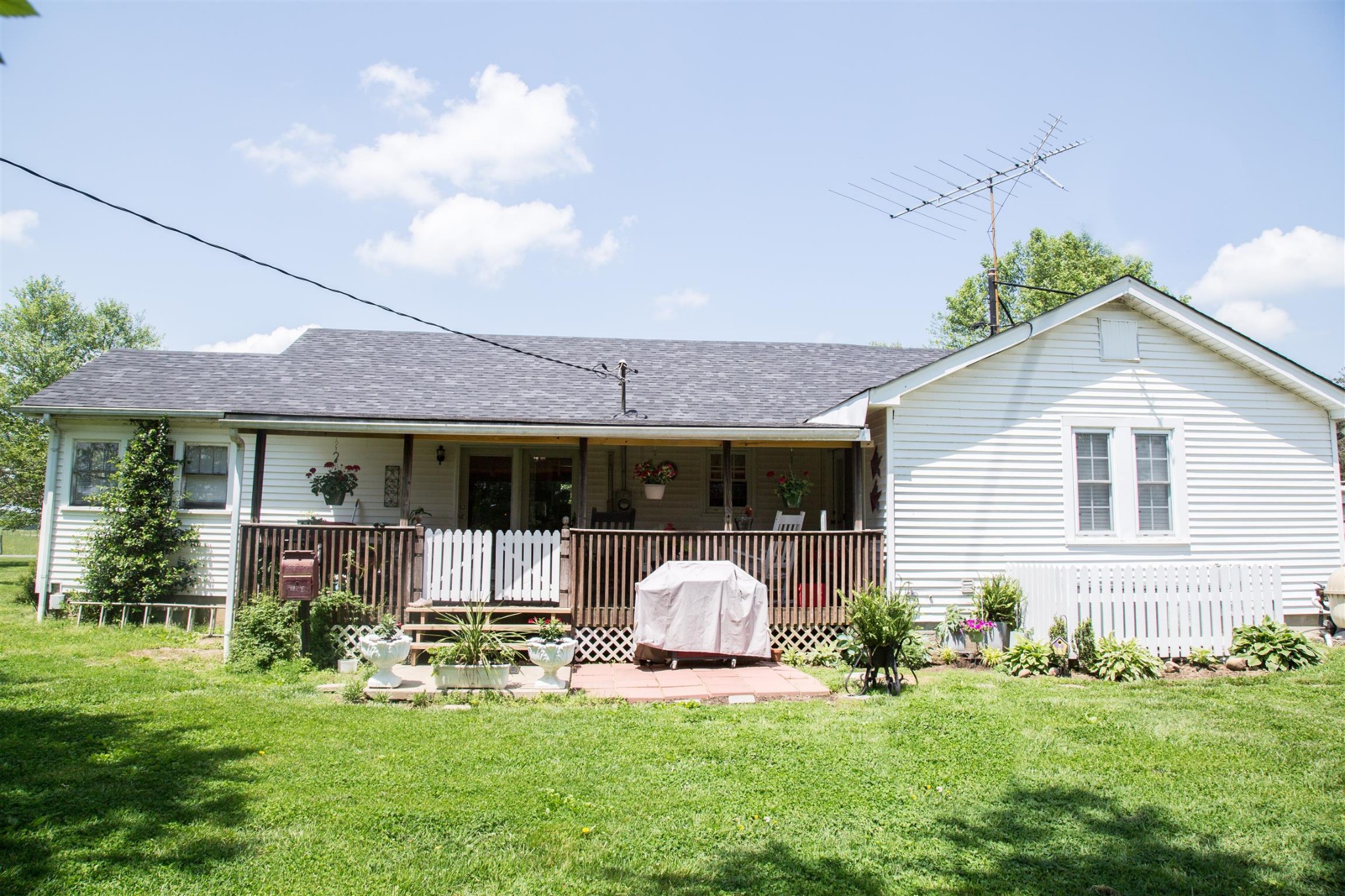 699 Mcelhiney Road Dickson, TN 37055 - Photo 22 of 25 a front view of a house with a yard and porch