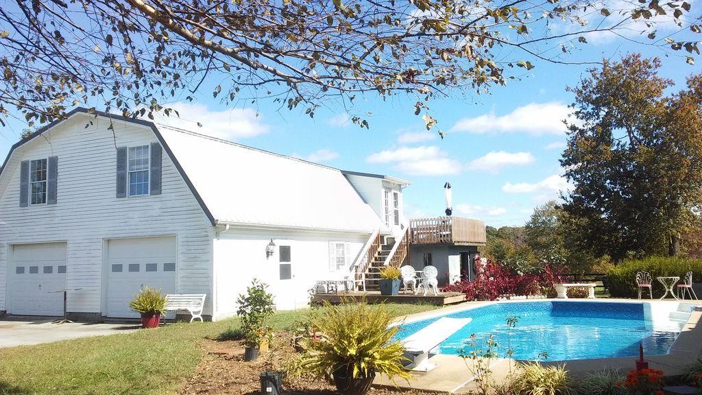 699 Mcelhiney Road Dickson, TN 37055 - Photo 4 of 25 a front view of a house with a yard