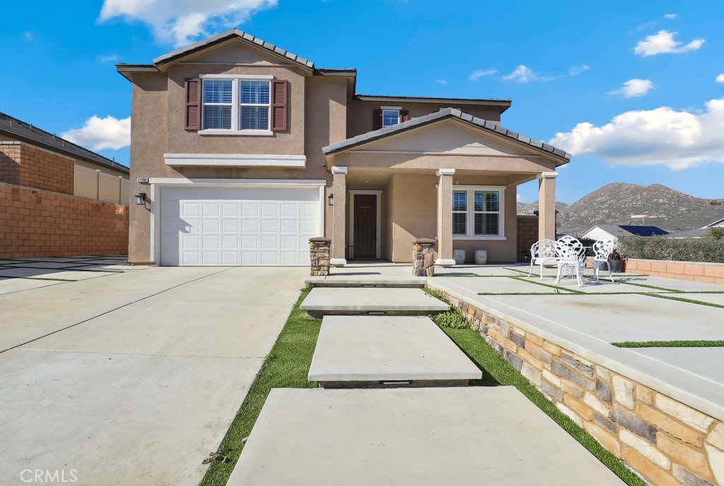 21300 Bison Mesa Road, Unit R Riverside, CA 92507 - Photo 1 of 1 a front view of a house with swimming pool and glass windows