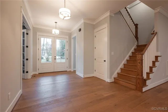 a large kitchen with stainless steel appliances kitchen island granite countertop a refrigerator and a sink