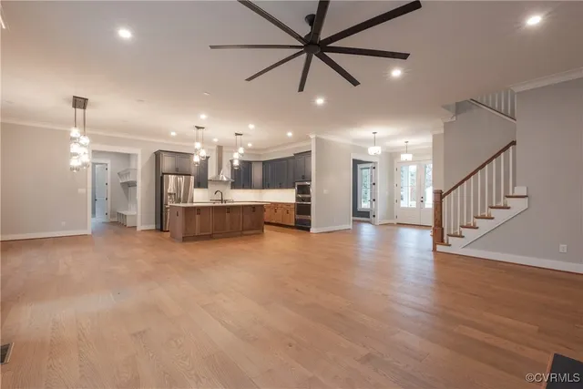 a bathroom with a granite countertop sink a mirror and a shower
