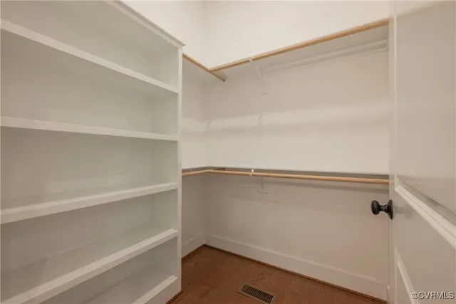 an aerial view of green landscape with trees houses and mountain view