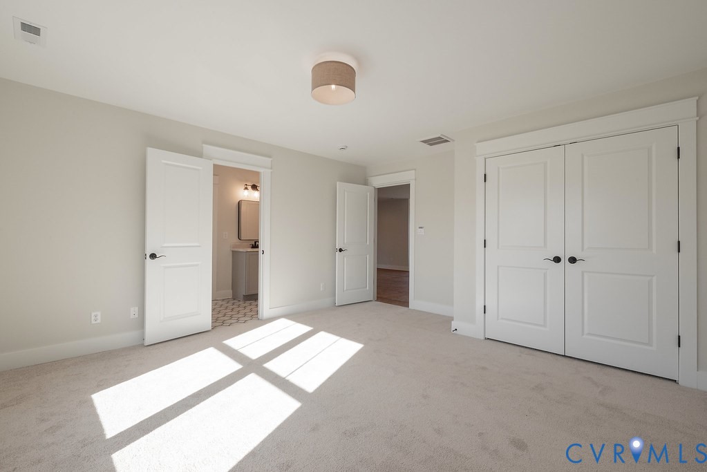 2110 Manakin Road Manakin-Sabot, VA 23103 - Photo 39 of 50 Unfurnished bedroom featuring light carpet, a clos