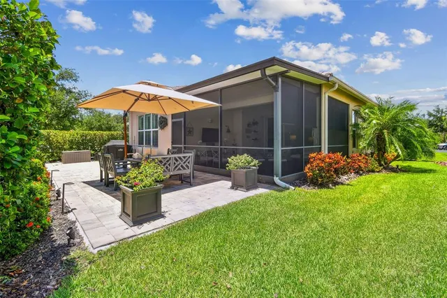a view of a chair and table on the garden