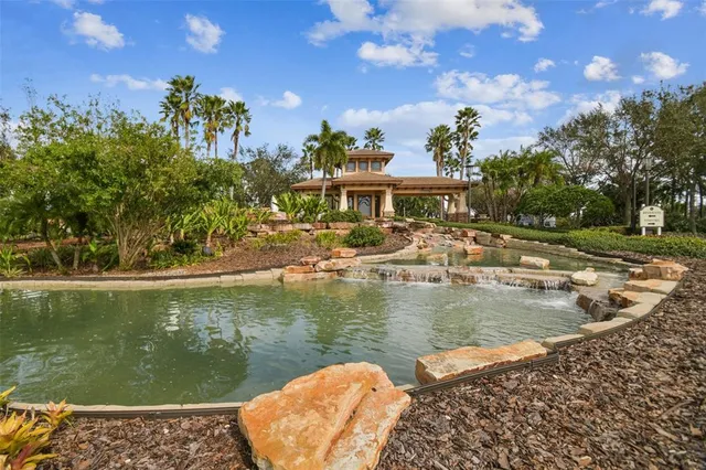 a view of a lake with a house in the background