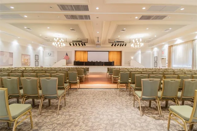 a large kitchen with a table and chairs