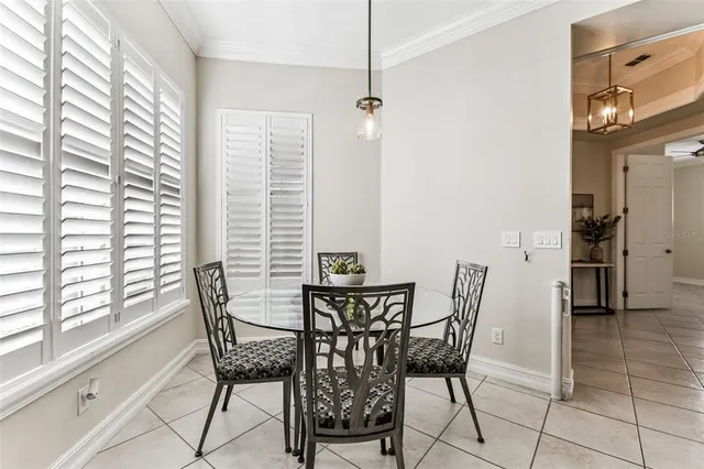 a view of a dining room with furniture and window