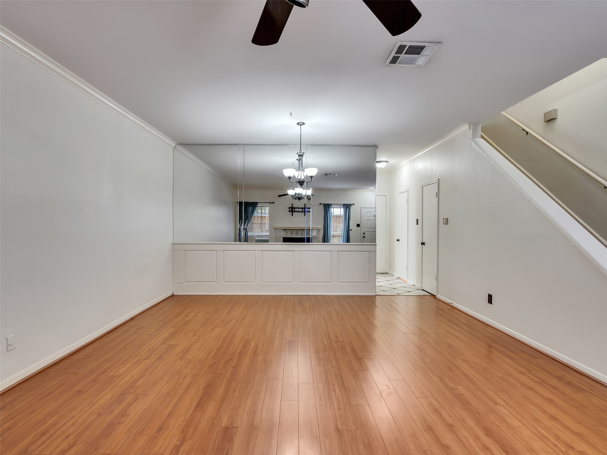 4001 Tanglewilde Street, Unit 605 Houston, TX 77063 - Photo 9 of 29 wooden floor in an empty room with a window