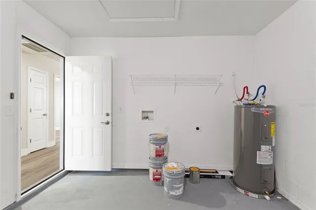 a view of storage and utility room with closet