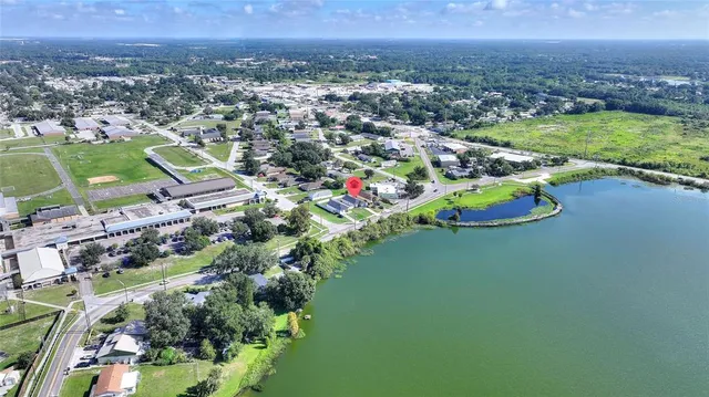 a aerial view of a house with a yard