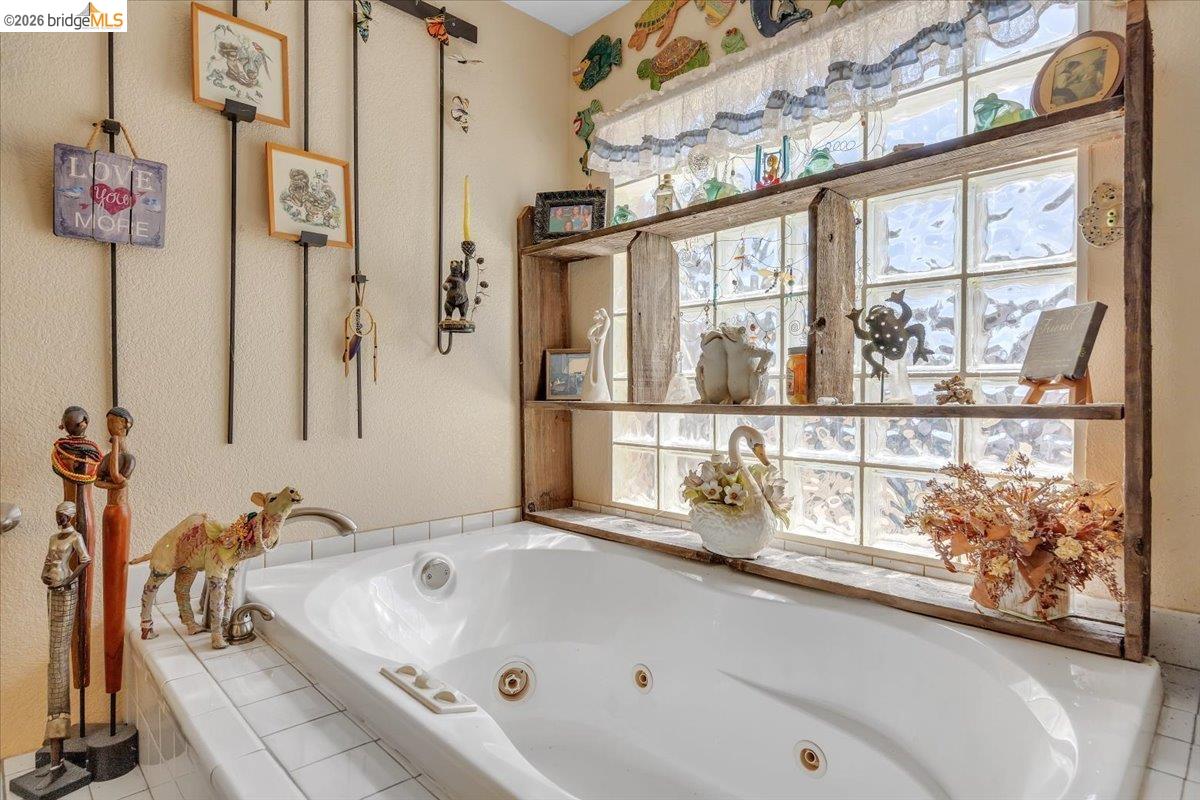 14450 Jacksonville Road Jamestown, CA 95327 - Photo 39 of 85 Built-in jetted tub with white tile surround