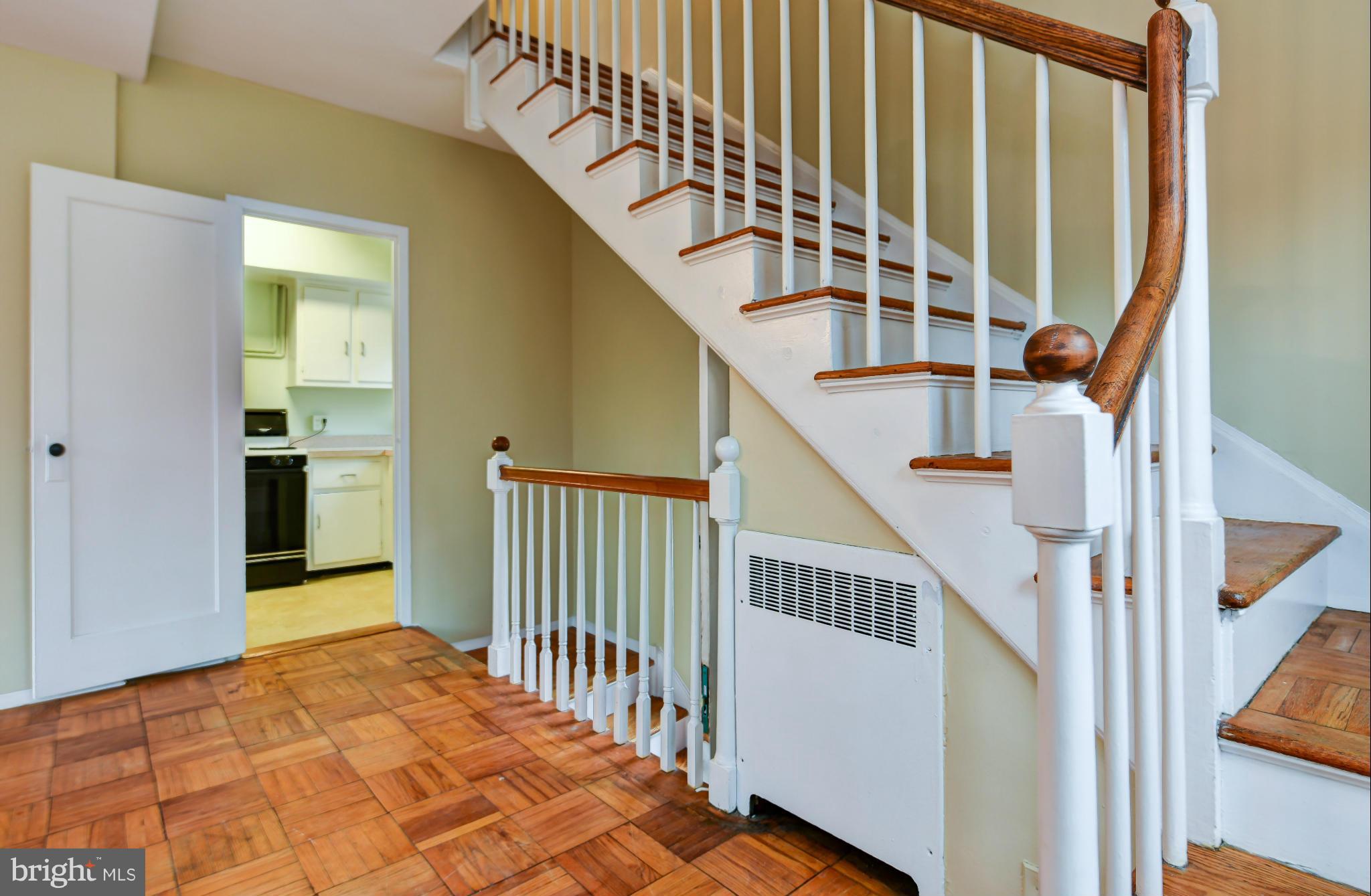 3538 Gunston Road Alexandria, VA 22302 - Photo 12 of 30 a view of staircase with lots of frames on wall and a window
