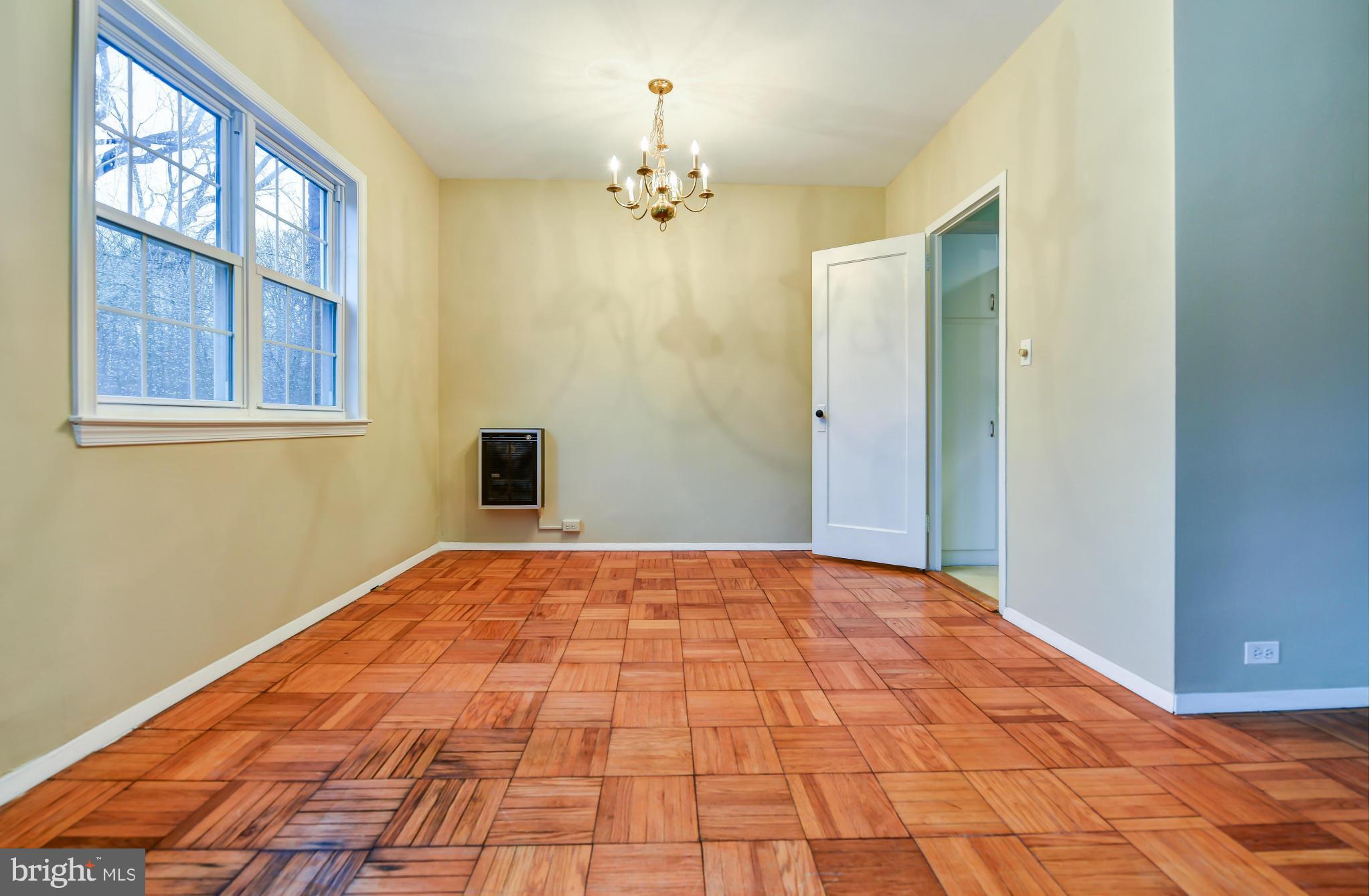 3538 Gunston Road Alexandria, VA 22302 - Photo 7 of 30 a bedroom with a bed and a chandelier