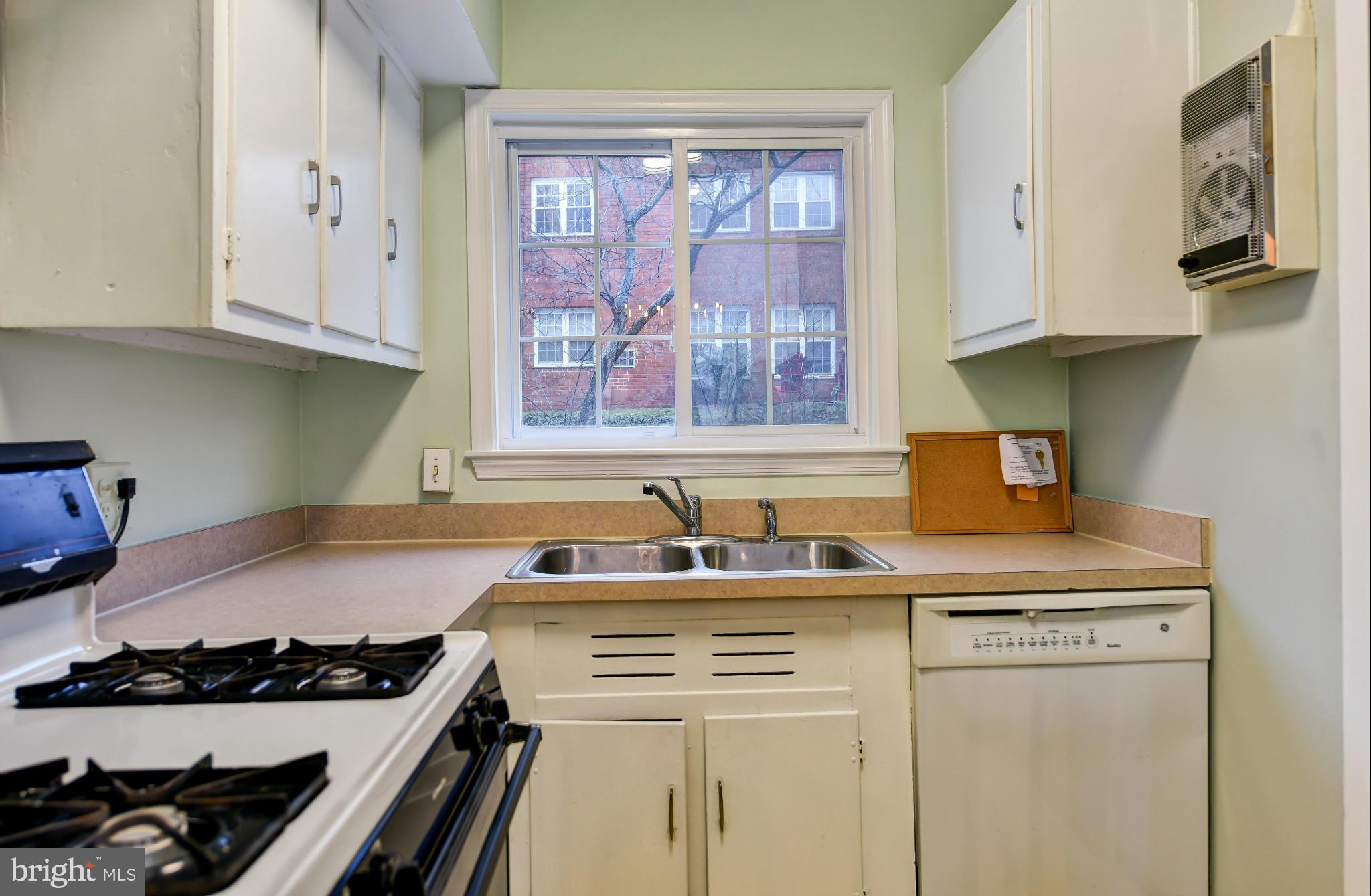 3538 Gunston Road Alexandria, VA 22302 - Photo 9 of 30 a kitchen with stainless steel appliances granite countertop a stove and a sink
