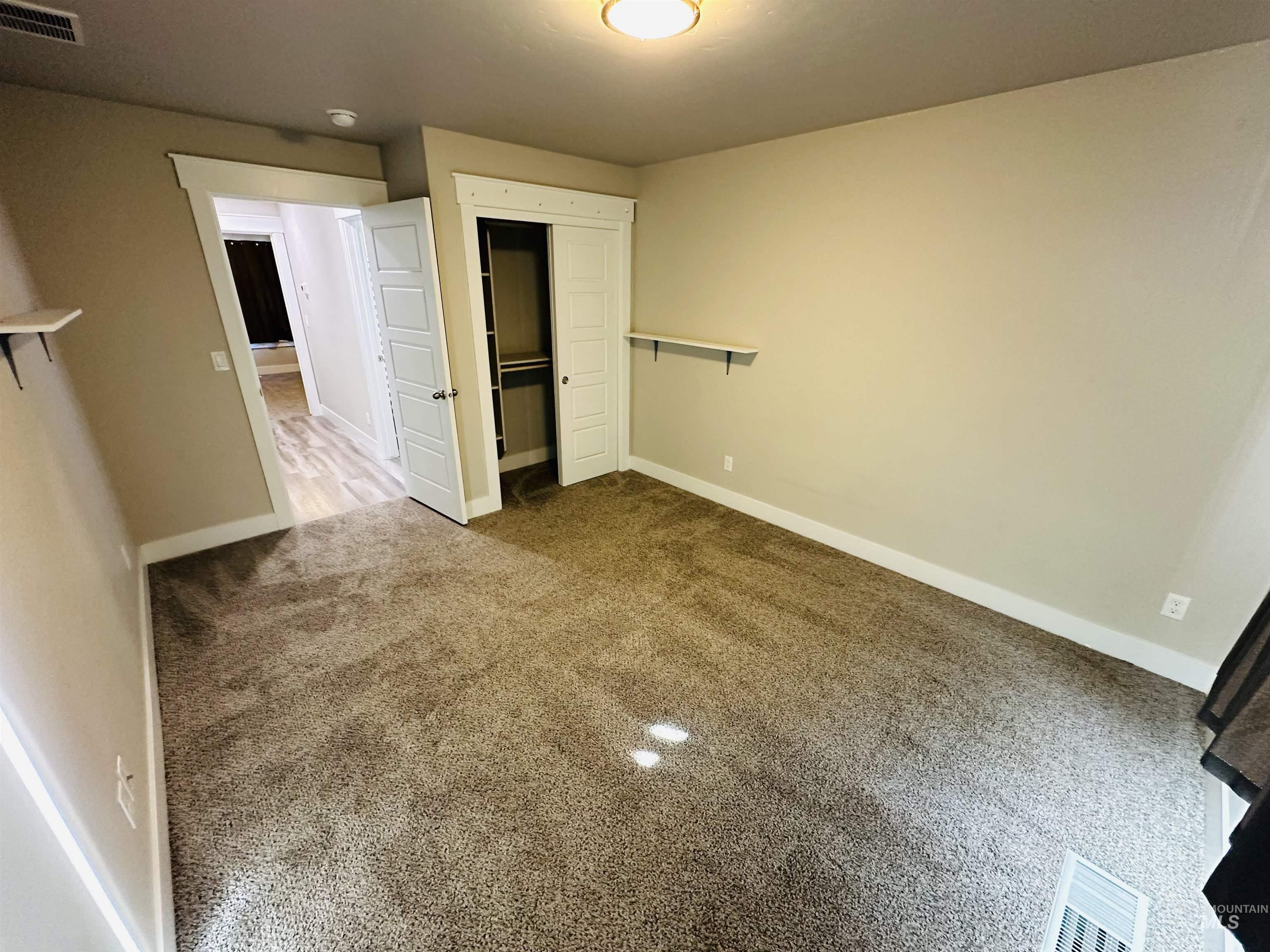 911 Campbell Street Vale, OR 97918 - Photo 19 of 37 Unfurnished bedroom featuring a closet and carpet floors